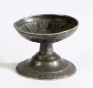 A small pewter cast-decorated footed cup or salt, possibly 16th century, Dutch The interior of the