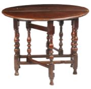 A William & Mary oak gateleg table, circa 1690 Having an oval drop-leaf top, formed mainly from