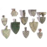 A group of eight small 14th century copper-alloy horse harness pendants, English For PICKARD;