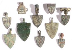 A group of eight small 14th century copper-alloy horse harness pendants, English For PICKARD;