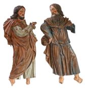 Two 17th century walnut and polychrome-decorated appliqués of saints, German/Swiss Each modelled