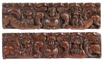 A pair of 17th century carved oak drawer fronts, dated 1675 Each carved with a pair of recumbent