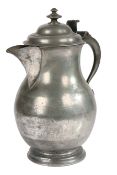 A mid-18th century pewter baluster-shaped laver/flagon, circa 1750 Having a domed lid with two-