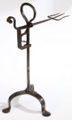 A George III wrought iron standing bird spit, circa 1790 The fork of three tines, rising and falling