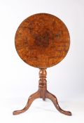 A late George III yew and burr-yew tripod occasional table, circa 1820 The circular tilt-top with