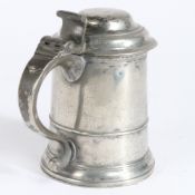 A George I pewter OEWS quart domed-lidded straight-sided tankard, circa 1720 The drum with low