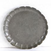 A George I/II pewter strawberry dish, circa 1720-40 Having a twenty-two lobed wavy edge rim and flat