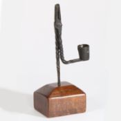 A George III wrought iron rushnip and candleholder, North Wales, circa 1800 With a twist-work stem