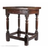 A Charles I oak centre table, circa 1630 Having an impressively thick one-piece top, the rails