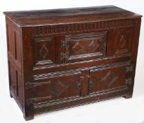 A Charles I joined oak court cupboard base, North Country, circa 1640 Having a triple-boarded and