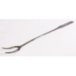 A George II iron meat fork, circa 1750 With two tines, plain stem and flattened handle with