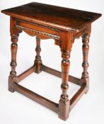 An oak joint stool, English Elements mid-17th century, having a one-piece top, with rounded edges