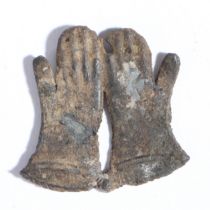 A 14th century pewter pilgrim badge, St. Thomas Becket’s gloves The pair of gauntlet-like gloves