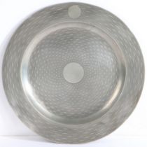A George III pewter plate, with engine-turned decoration, circa 1780 The all-over wavy-linear