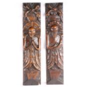 A pair of James I carved oak figural terms, circa 1610 One male (atlantes) with folded arms, the
