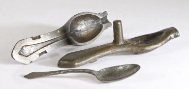 A Queen Anne bronze spoon mould, circa 1710 Typically in two parts, with cast dog nose spoon, length