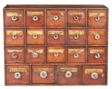 A boarded and joined pine bank of nineteen small apothecary drawers, English, circa 1830-50 The