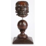 An early 17th century carved oak African male head mount, English, circa 1600-20 Designed with