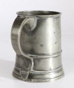 A rare George I pewter straight-sided pint mug, circa 1725 With raised low band to tapering drum,