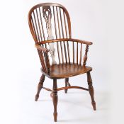 An early Victorian yew and elm high-back Windsor armchair, circa 1840 The hooped back with four long