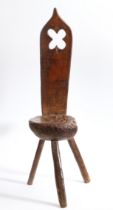 An interesting pine primitive chair, Welsh, circa 1800 Having a slender tapering back board, with