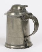 A Queen Anne pewter OEWS quart high domed-lidded tankard, circa 1710 The straight-sided tapering