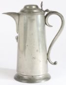 A George III pewter spouted domed-lidded flagon, circa 1790-1820 Having a plain straight-sided