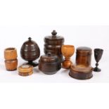 A collection of treen To include three tobacco jars and covers, three pots and covers and three