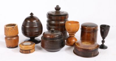 A collection of treen To include three tobacco jars and covers, three pots and covers and three