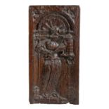 A mid-16th century carved oak panel of St. Barbara, French, circa 1550 The female saint standing