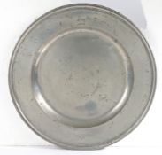 An early 18th century pewter multi-reeded charger, Somerset, circa 1700-20 The semi-broad rim with