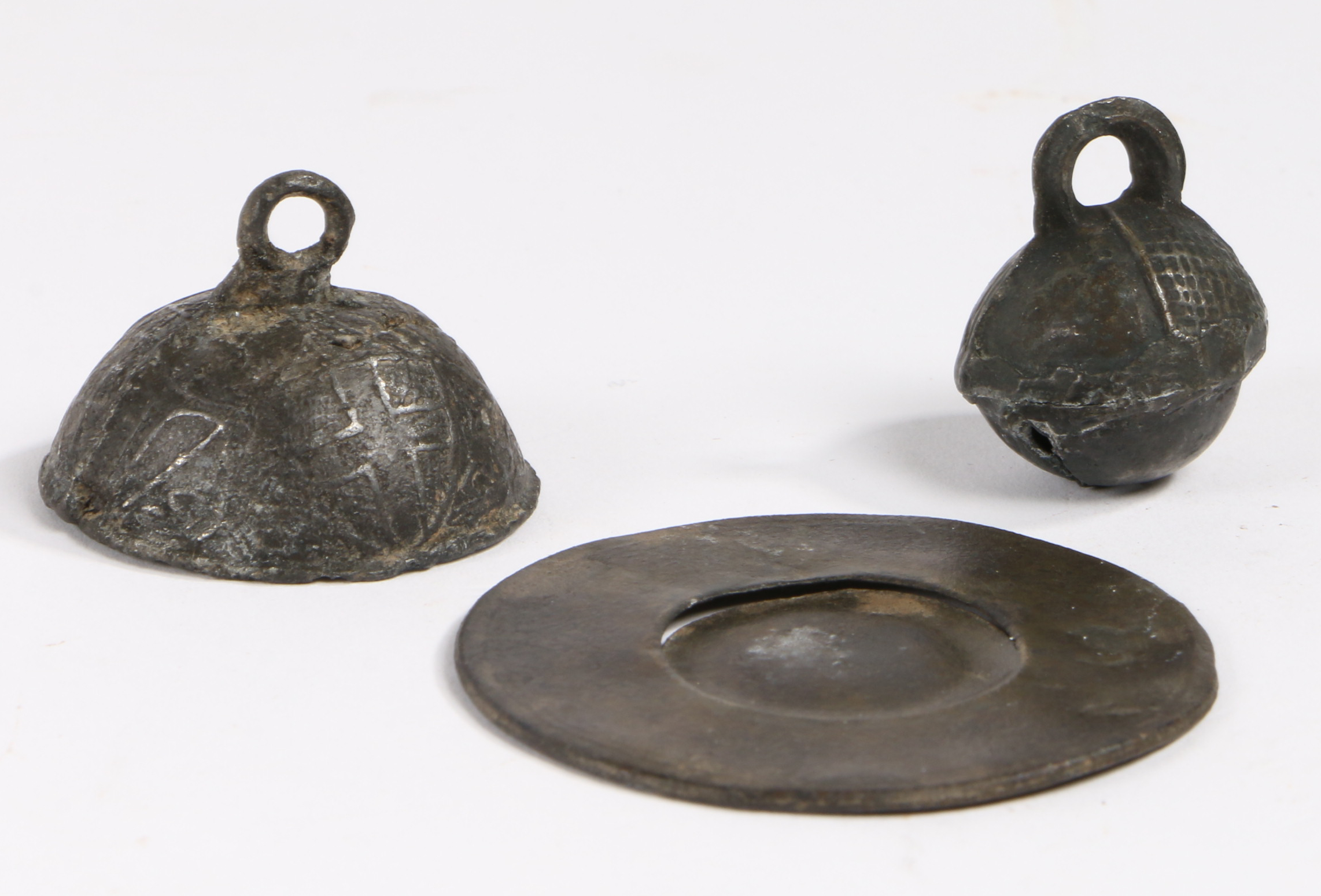 A 17th century pewter toy broad rim charger, circa 1680 With maker’s mark to single reed rim and