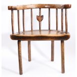 A George III primitive ash and elm comb-back Windsor armchair, Welsh, circa 1780 With horse-shoe