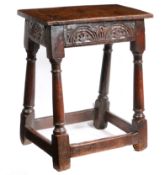 A Charles I oak joint stool, circa 1640 Having a square-edge top with chamfered upper-edge,