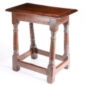 A Charles II oak joint stool, circa 1660 and later Having an ovolo-moulded top, lower edge-moulded