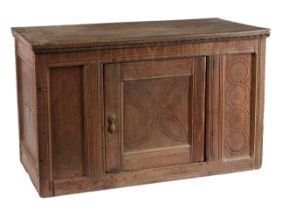 An Elizabeth I oak food hutch, circa 1600 The top of two plain boards, atop a front gauge-carved