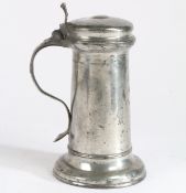 A Charles I pewter flagon, circa 1640 Having a tapering straight-sided drum with paired incised