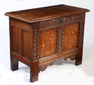 A small James I/Charles I oak and inlaid coffer, Yorkshire. circa 1610-30 The hinged top off two