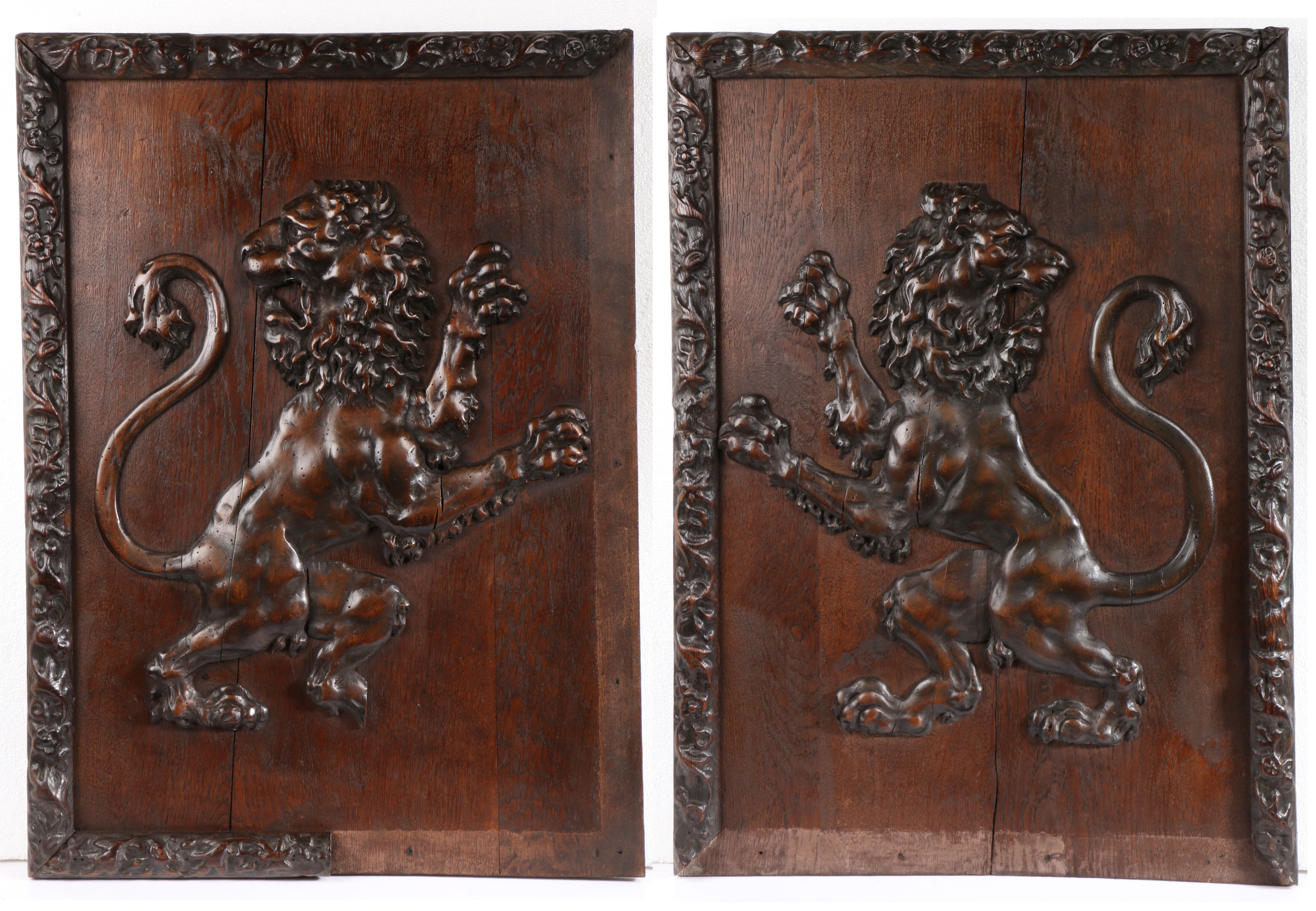 A pair of large early 19th century carved ‘limewood’ and oak framed lion rampant panels  One