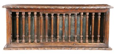 A Charles I oak and elm mural glass case, West Country, circa 1640 Having seventeen columnar-