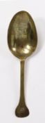A 17th century brass spoon Having a relatively short, flat, broad stem with rounded flat terminal,