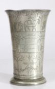 A fine and interesting pewter wrigglework decorated beaker, Dutch, circa 1700-10 Of typical tall,