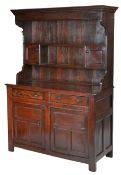 A George II oak fully enclosed high dresser, Denbighshire, circa 1740 The boarded canopy rack with