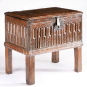 A James I boarded oak box, circa 1620 and later Having a near one-piece hinged lid, nulled-carved