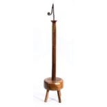 A 19th century and later sycamore, beech and ash standing rushlight holder With iron twist-work