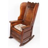A George I/II oak winged armchair, Welsh, circa 1720-40 Having a rectangular fielded back with