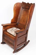 A George I/II oak winged armchair, Welsh, circa 1720-40 Having a rectangular fielded back with