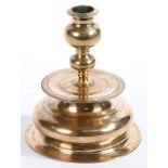 A rare and fine mid-17th century brass bell-base candlestick, by Stephan Forster, Nuremberg, circa