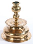 A rare and fine mid-17th century brass bell-base candlestick, by Stephan Forster, Nuremberg, circa