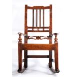 An early 19th century fruitwood, mahogany and alder wood child’s rocking chair, East Anglia, circa
